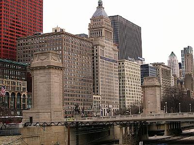 Monday 20 March, 2006  The sloping building on the far right is the Smurfit Stone Building. It was designed by a woman!  The building with the spire to the left of the Santa Fe building is the Metropolitan Tower on the Park built in 1924.