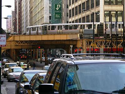 Monday 20 March, 2006  Wabash Ave with the overhead commuter train system. Can't think of too many any other cities that have elevated trains down the middle of city streets like this - bits of Paris maybe?