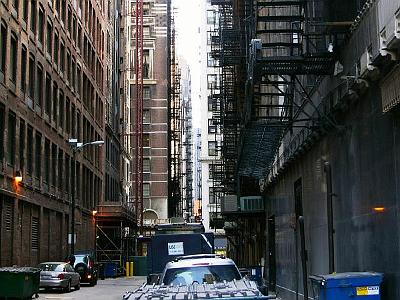 Monday 20 March, 2006  The back alleys are interesting. Full of fire escapes and rubbish bins.